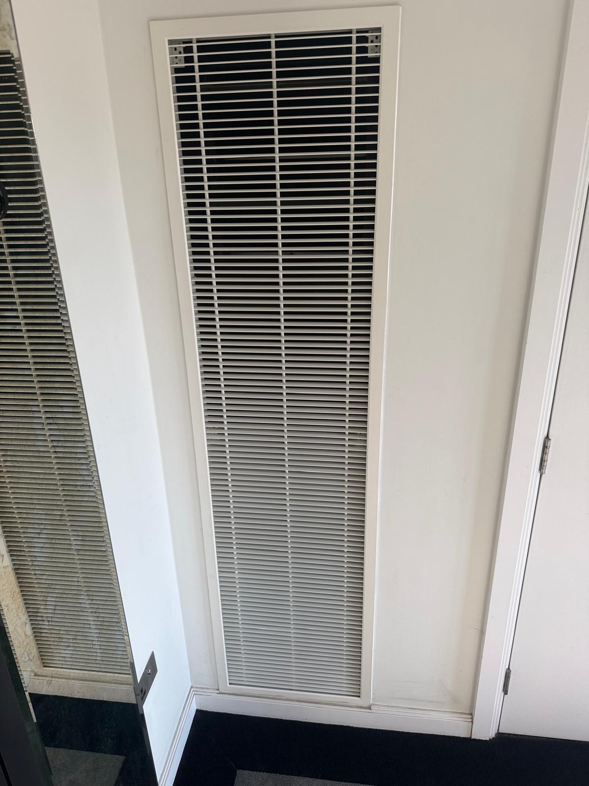 high-level ventilation grille during AOV maintenance in Barking, Essex