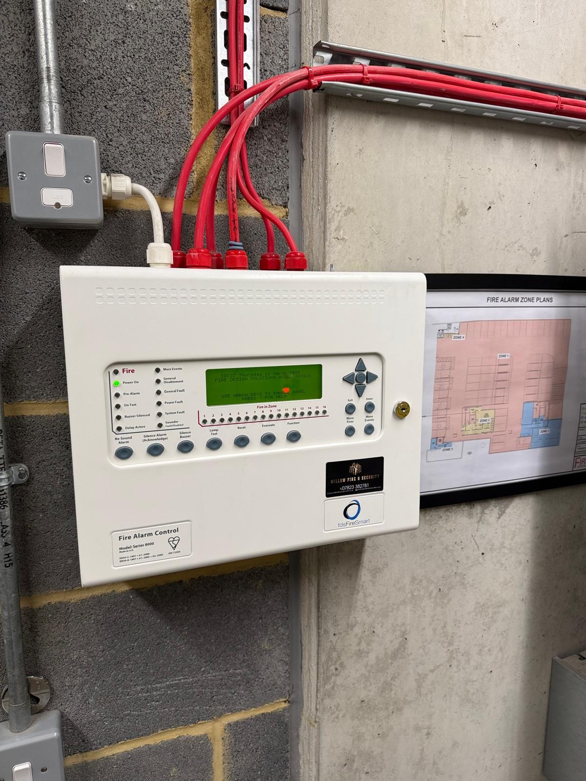 fire alarm control panel in residential car park during fire alarm maintenance in Hammersmith