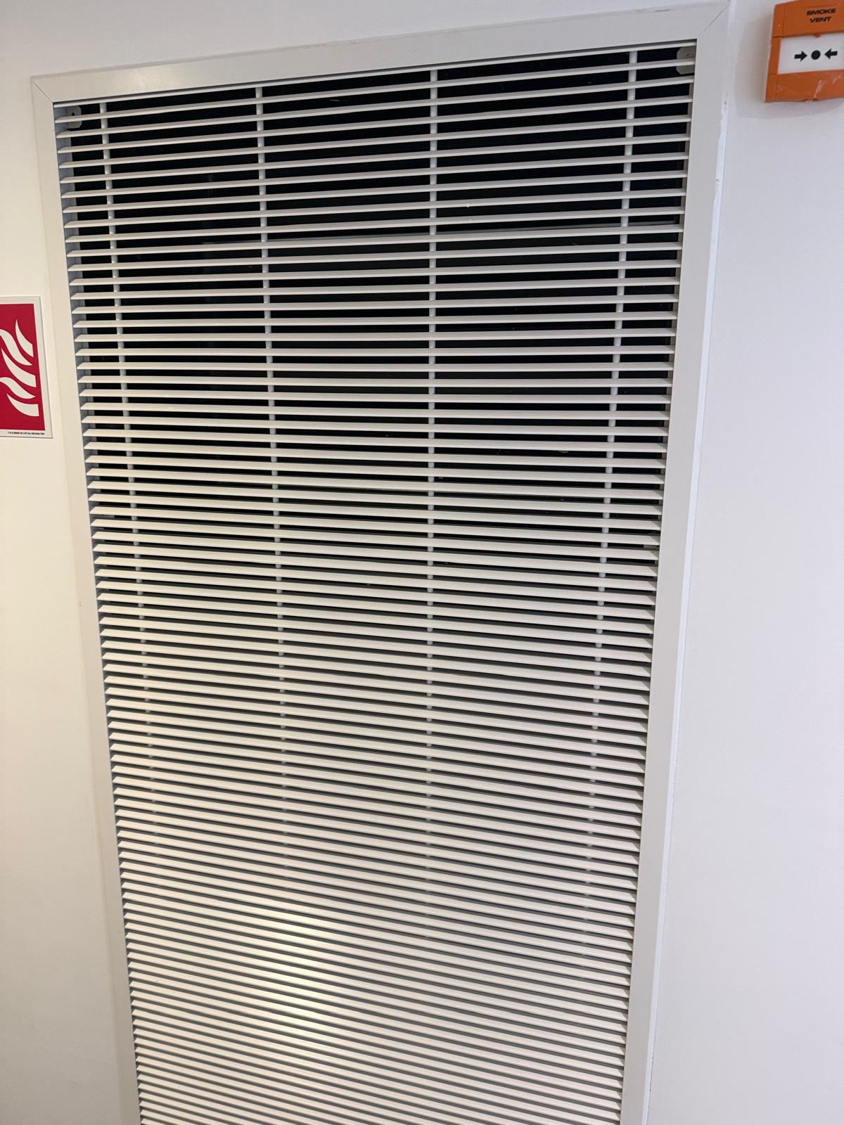mechanical smoke ventilation grille during mechanical AOV maintenance in Bethnal Green, East London