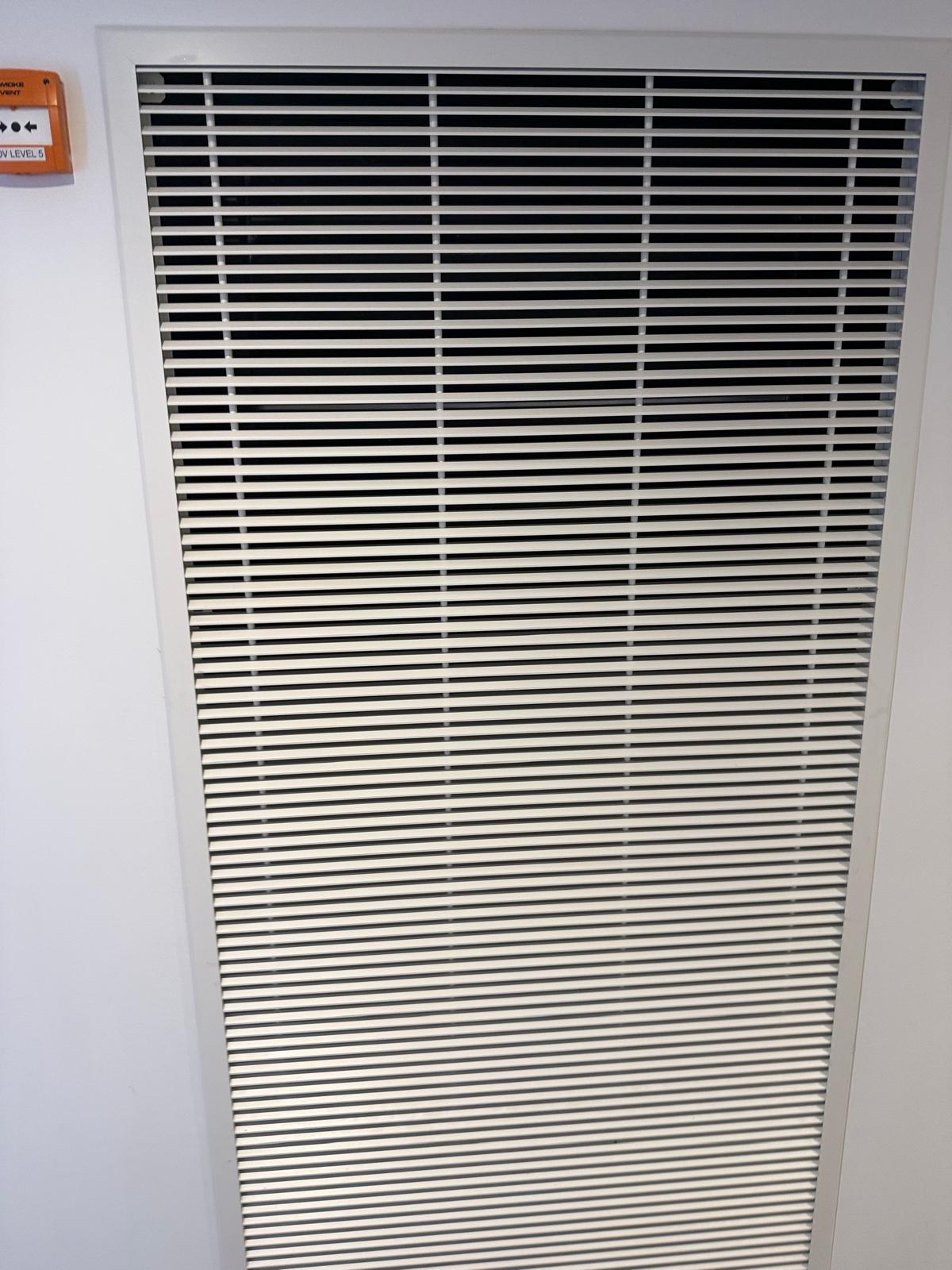 mechanical smoke ventilation grille during mechanical AOV maintenance in Bethnal Green, East London