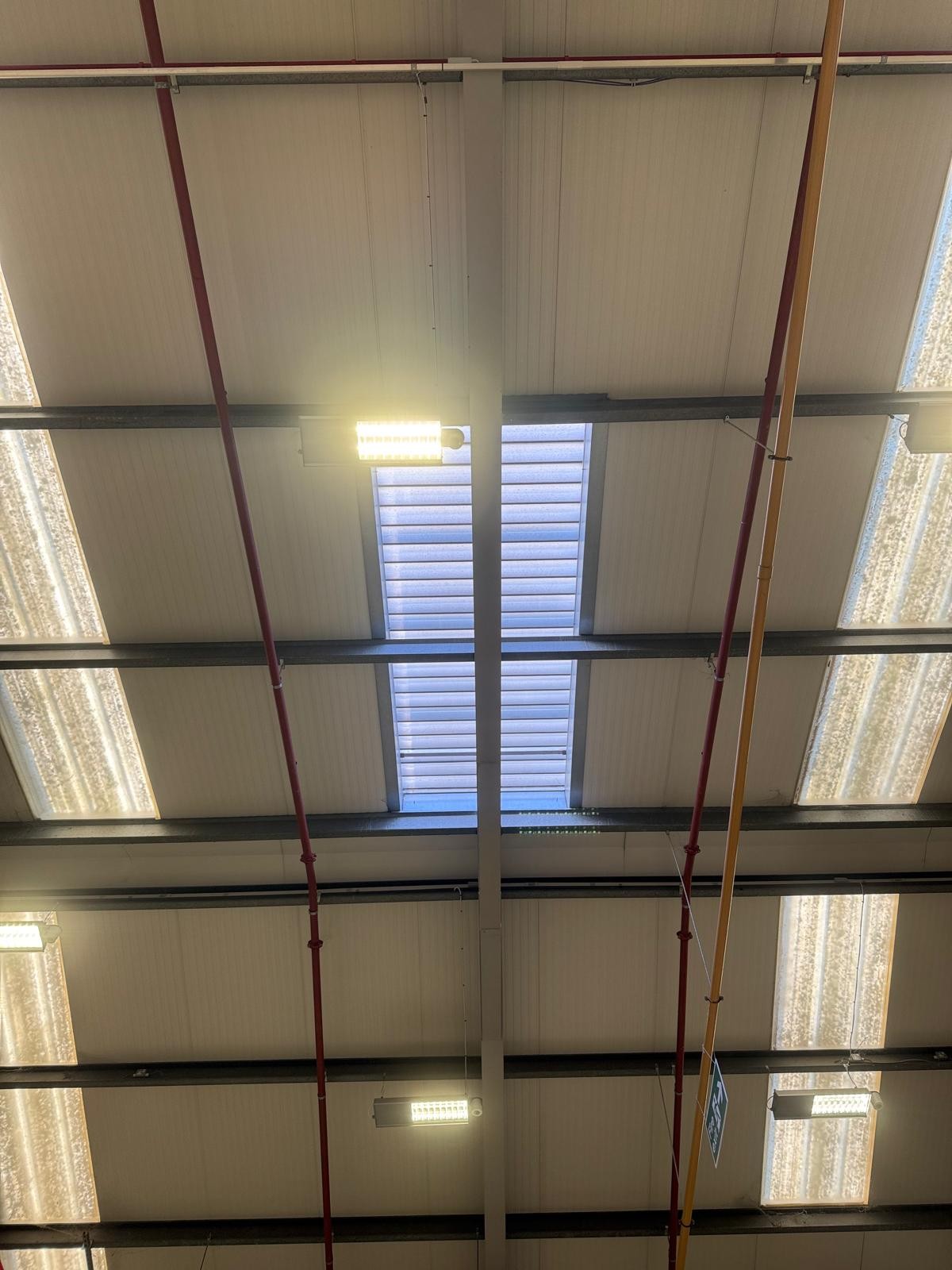 warehouse roof smoke vents during warehouse roof AOV system maintenance in Charlton